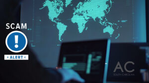A person is on a computer, the dark web, trying to access others account information. A large monitor is displaying the world map.