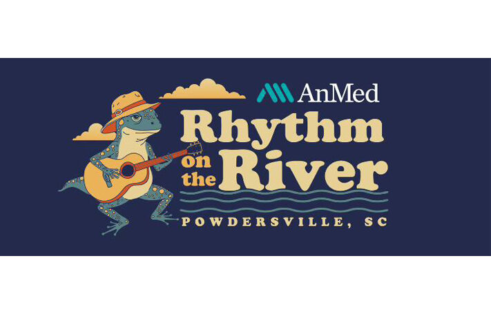 A stylized event graphic showing a spotted blue frog wearing an orange hat and playing an acoustic guitar. Next to the frog is the event title “AnMed Rhythm on the River” with wavy lines suggesting water, and the location “Powdersville, SC.” The background is dark navy with decorative clouds and the AnMed logo above the title.